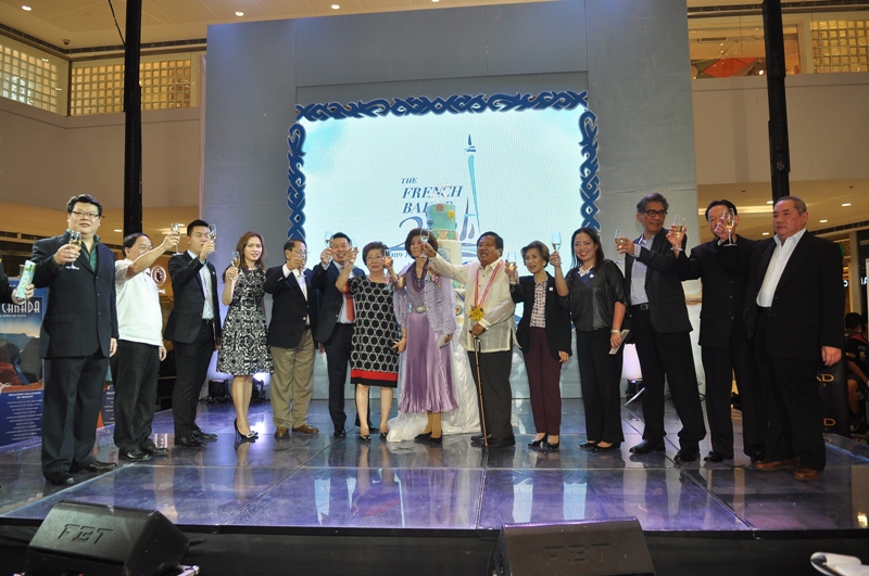 Celebratory Toast The French Baker Founder and CEO Johnlu G. Koa (6th from the left) toast with friends and family as they launch the “Visit Paris in Summer 2015” at the SM Mega Fashion Hall in Mandaluyong City on November 4. The launch of the promo marks French Baker’s 25 years of bringing European-style breads to the Filipino market and is the company’s way of saying ‘thank you’ to the customers who have embraced and supported the patisserie over the years.